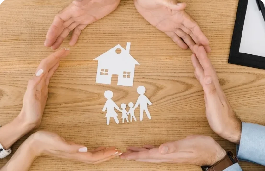 Paper cutout family inside protective hand circle